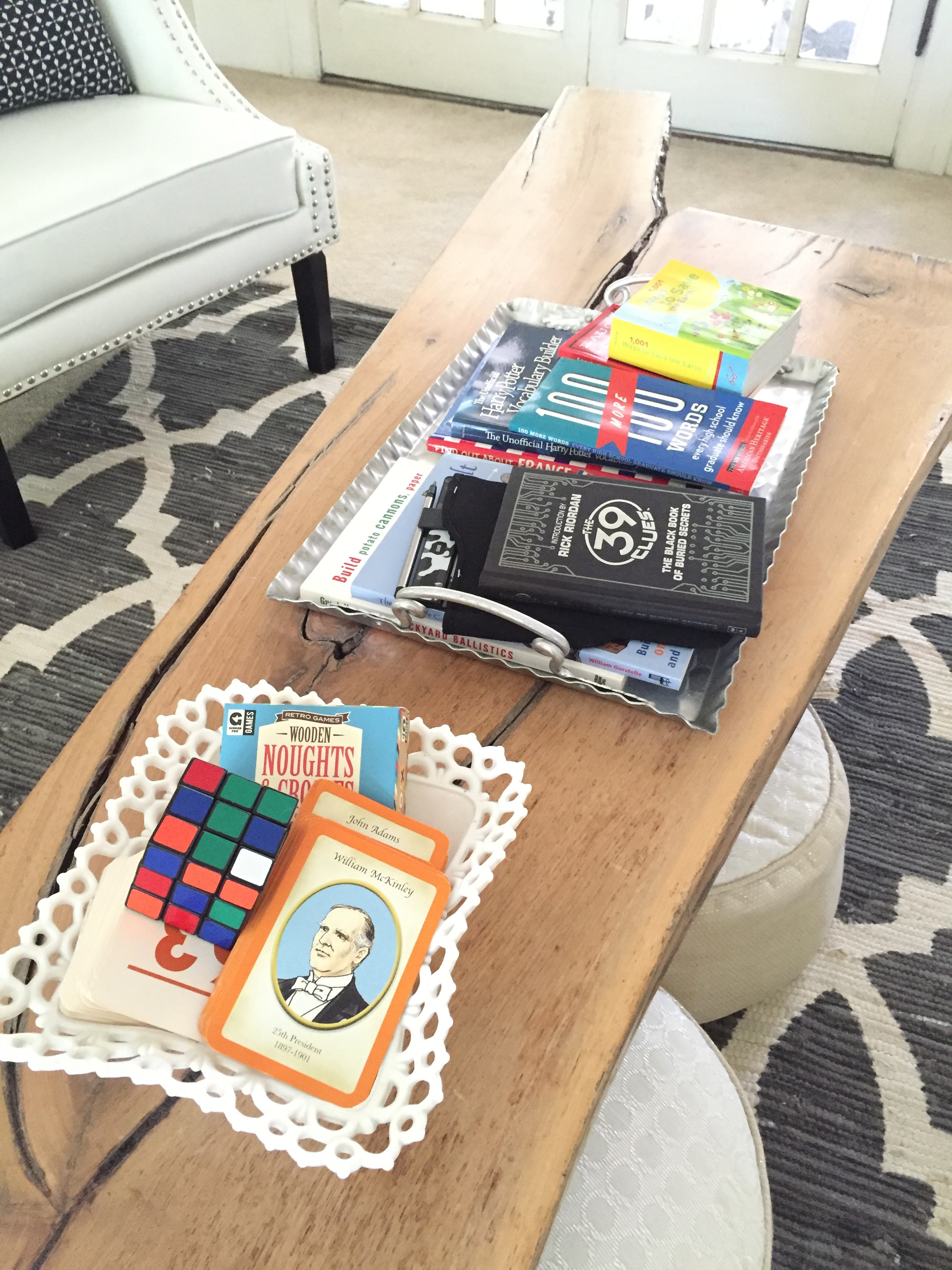 coffee table filled with educational games & books for summer learning!
