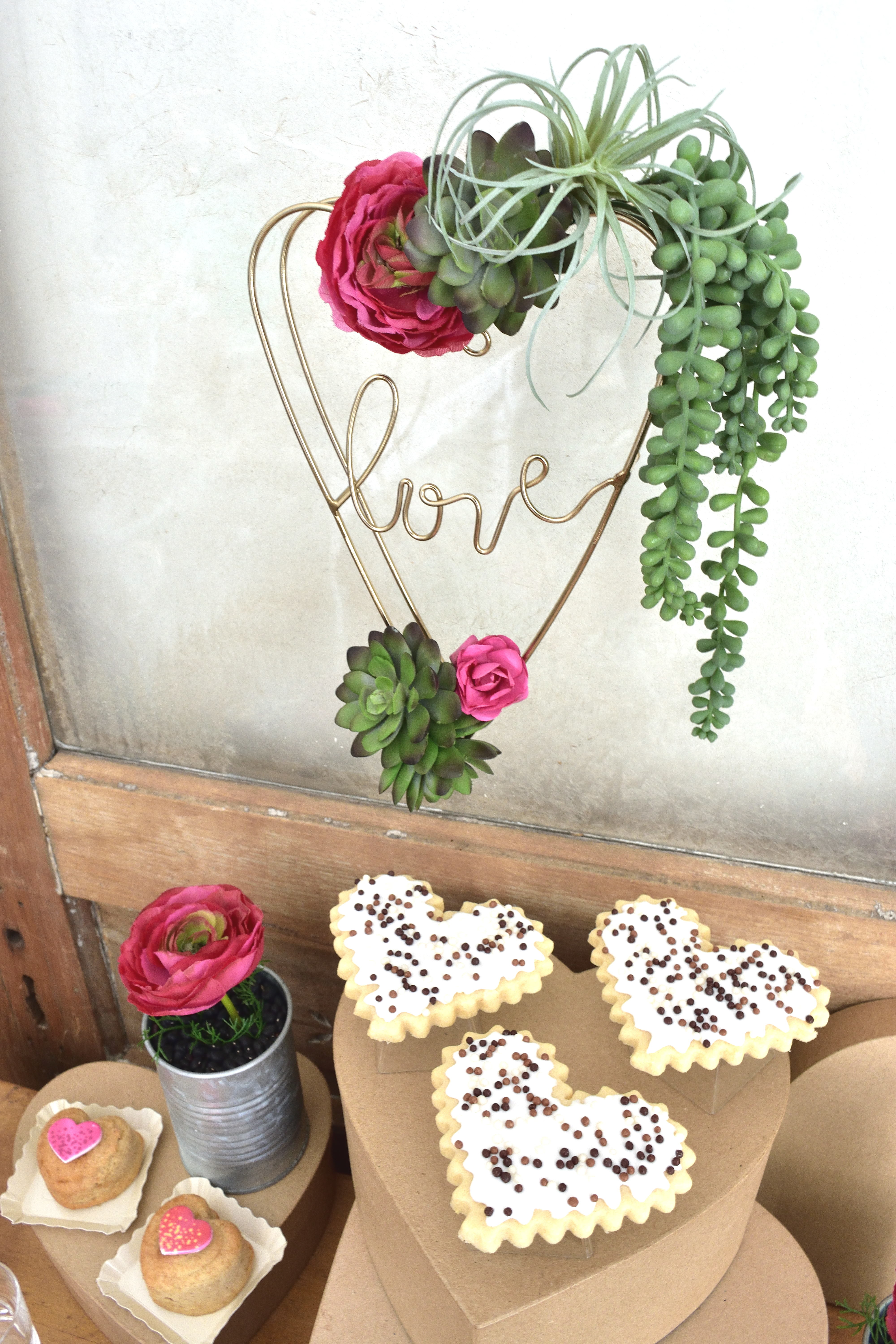 valentine treat table with a succulent theme